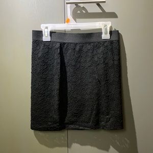 Black mini bodycon skirt with lace design